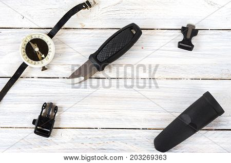 Knife, A Compass And A Flint For A Tourist And A Hunter.
