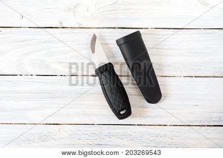 Swedish Knife And Plastic Sheath In The Center Of The Composition.