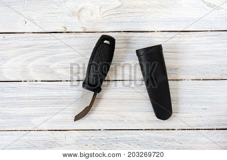 Swedish Knife And Plastic Sheath In The Center Of The Composition On White Background.