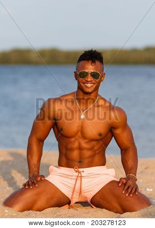 Muscular Young Athletic Sexy Man On The Beach With A Naked Torso