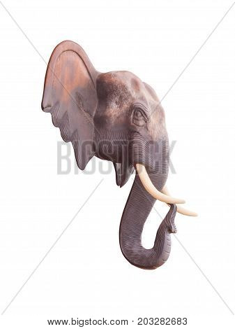 Wood carving the head of the elephant commonly used in ornamental building isolated on white background with clipping path.