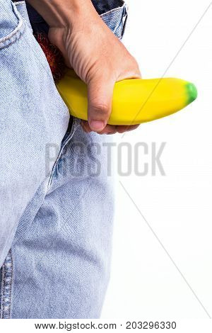 Hand Holds A Big Banana Sticks Out Of A Blue Jean Demonstraiting A Penis