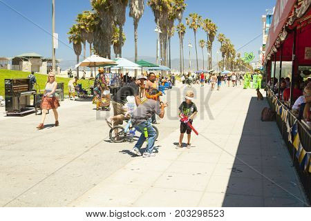 santa monica pier with families walking in an hot afternoon in summer  los angeles california
