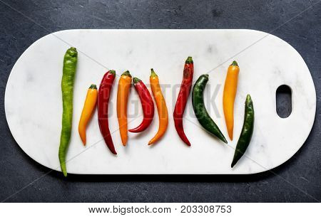Aerial view of cayenne chili peppers on cutboard