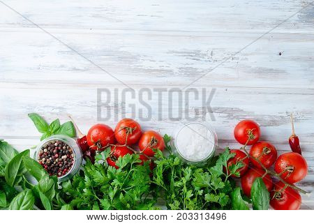 Tomatoes And Bunch Of Fresh Green Basil On A  Wood Background,