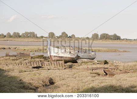 Old Ruin Of A Boat On Beach During Sunset Of Coastline In  Maldon