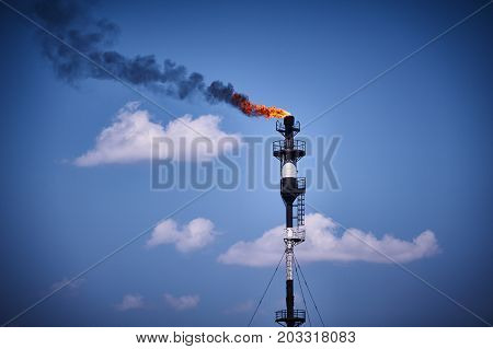 Torch on the gas tower. Oil and gas industry
