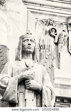 Detail photo of statues in mausoleum of The Andrassy family near castle Krasna Horka Slovak republic. Memorial architecture. Black and white photo.