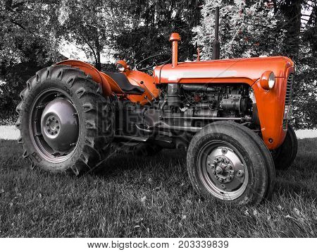 Photo of red old tractor . .