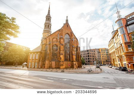 Beautiful cityscape view on the old downtown with saint Catherines church during the sunset in Hamburg city, Germany