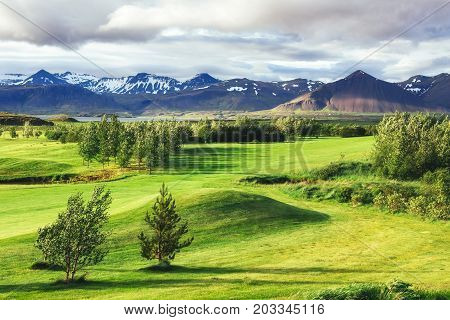 Valley National Park Landmannalaugar. On the gentle slopes of the mountains are snow fields and glaciers