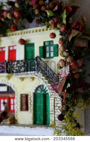 Small house miniature wifth flowers and berries