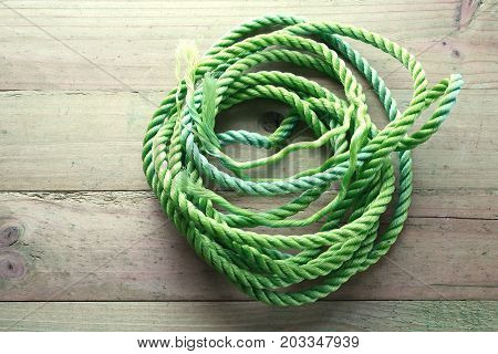 Bundle of Nylon Rope on Wooden Background