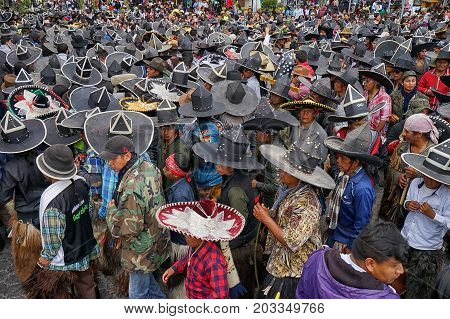 June 29 2017 Cotacachi Ecuador: indigenous Kichwa crowd on the street celebrating Inti Raymi