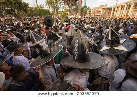 June 29 2017 Cotacachi Ecuador: men wearing extra large hats during Inti Raymi celebration