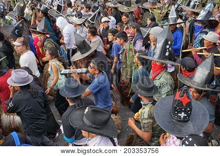 June 29 2017 Cotacachi Ecuador: kichwa indigenous men dancing in the town plaza at Inti Raymi