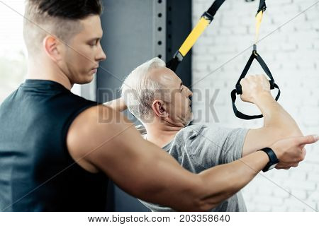 Sportsman Training With Trx And Trainer