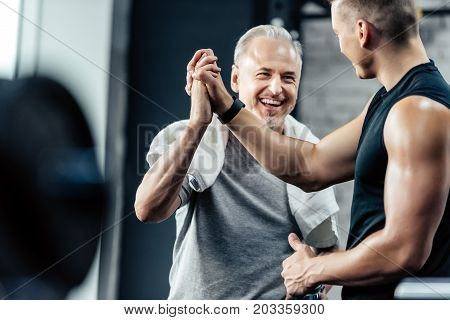 Sportsman Giving Highfive To Trainer