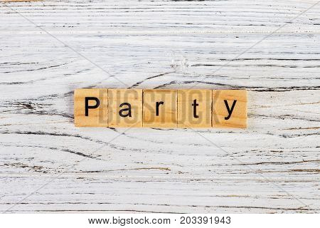 Party word on block concept. Wooden Blocks with the text: Party