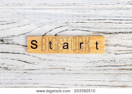 Start Word Written In Wooden Cube Concept