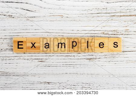 EXAMPLES word made with wooden blocks concept
