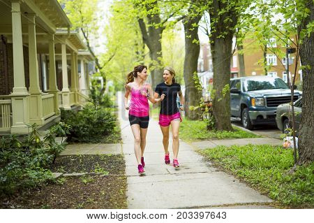 Two Beautiful Female runner outside having fun