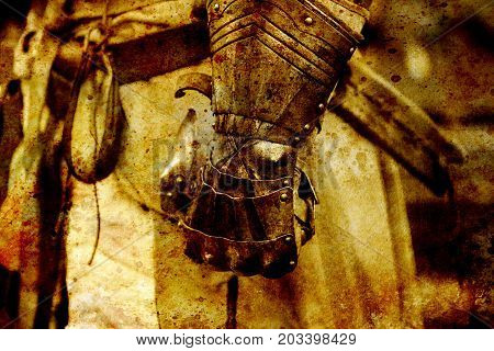 Detail knight armor. Gloves of a knight. Sepia effect