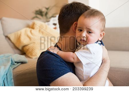 Father Comforting Crying Baby