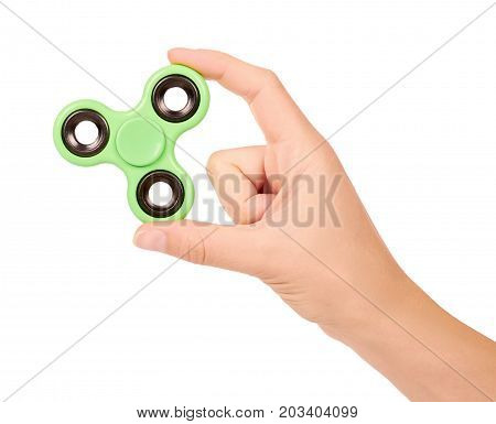 Green Fidget Spinner In Hand Isolated On White Background