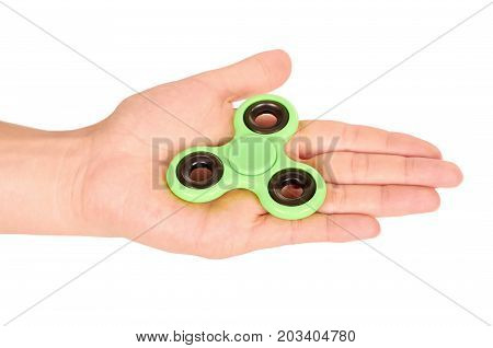 Green Fidget Spinner In Hand Isolated On White Background