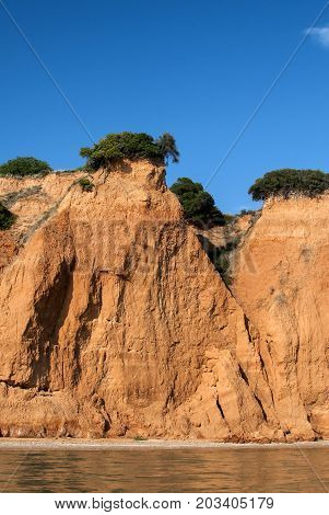 Effects of seaside coastal erosion with clayey soil