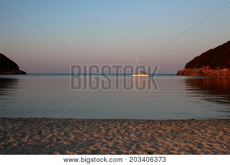 A view from the beach of Amoudia. A yacht on the horizon.