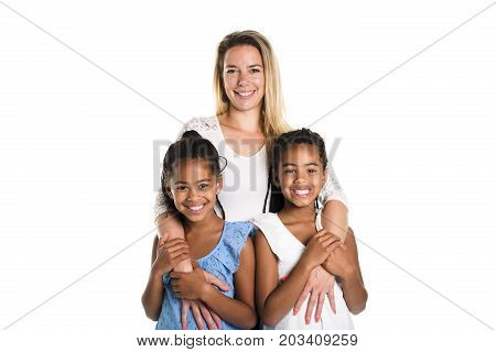 Two Afro twin child posing on a white background studio with white mother