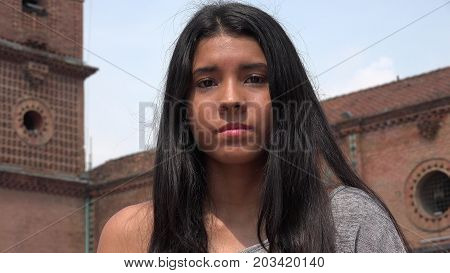 A Young Hispanic Serious Apathetic Teen Female