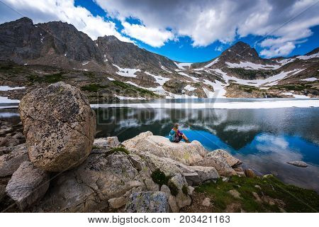 Tourist In Colorado Hiker Girl Rests At Blue Lake