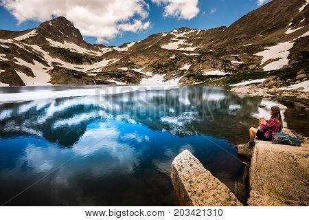 Tourist In Colorado Hiker Girl Rests At Blue Lake