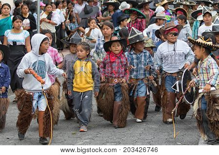 June 24 2017 Cotacachi Ecuador: young kichwa indigenous children participating at the summer solstice parade
