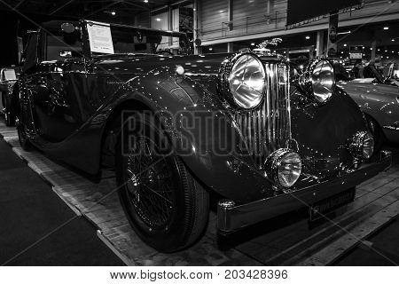 MAASTRICHT NETHERLANDS - JANUARY 08 2015: Oldtimer Jaguar Mark IV DHC. Black and white. International Exhibition InterClassics & Topmobiel 2015