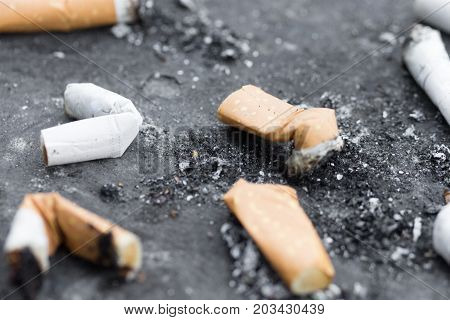 Cigarette butts, ant i- smoking law .