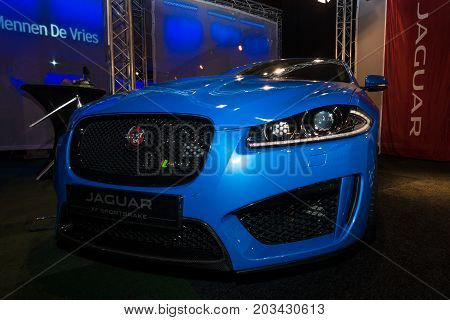 MAASTRICHT NETHERLANDS - JANUARY 08 2015: Mid-size luxury car Jaguar XF Sportbrake. International Exhibition InterClassics & Topmobiel 2015