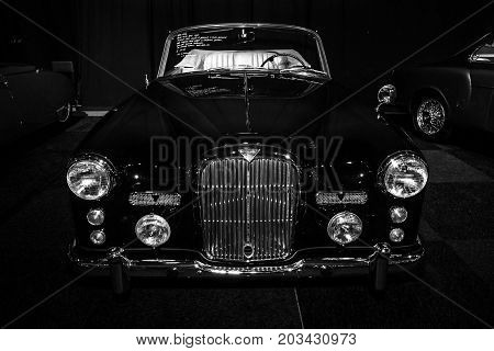 MAASTRICHT NETHERLANDS - JANUARY 08 2015: British sports car Alvis Three Litre TD21 DHC - Series I 1961. Black and white. International Exhibition InterClassics & Topmobiel 2015