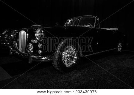 MAASTRICHT NETHERLANDS - JANUARY 08 2015: British sports car Alvis Three Litre TD21 DHC - Series I 1961. Black and white. International Exhibition InterClassics & Topmobiel 2015