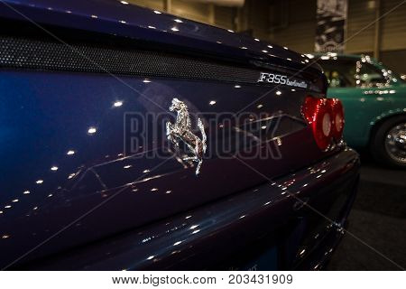 MAASTRICHT NETHERLANDS - JANUARY 08 2015: Fragment of a sports car Ferrari F355 Berlinetta. Rear view. International Exhibition InterClassics & Topmobiel 2015