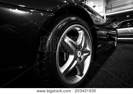 MAASTRICHT NETHERLANDS - JANUARY 08 2015: Fragment of a sports car Ferrari F355 Berlinetta. Black and white. International Exhibition InterClassics & Topmobiel 2015