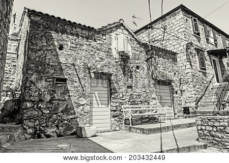 Traditional old house in Solta island Croatia. Travel destination. Summer vacation. Black and white photo.