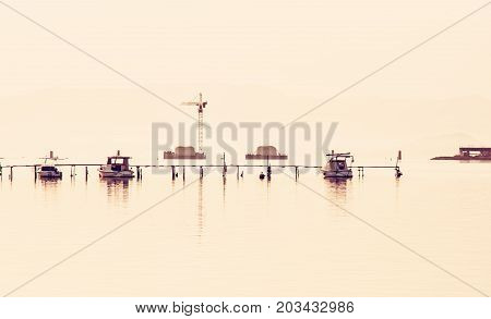 Construction of a new bridge from Trogir to the Ciovo island Croatia southern Europe. Red photo filter.
