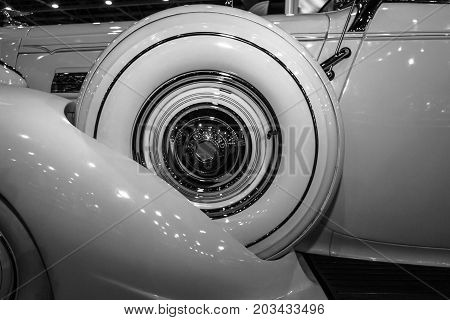 MAASTRICHT NETHERLANDS - JANUARY 08 2015: Fragment of a Packard 120 Convertible Sedan with Dietrich Body 1937. Black and white. International Exhibition InterClassics & Topmobiel 2015