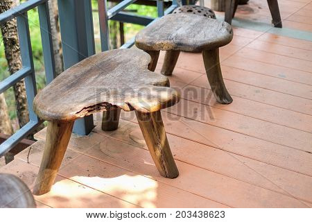 Brown wooden chairs set on the wooden floor for background or texture.