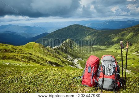 Backpacks in the mountains with views of the mountains.