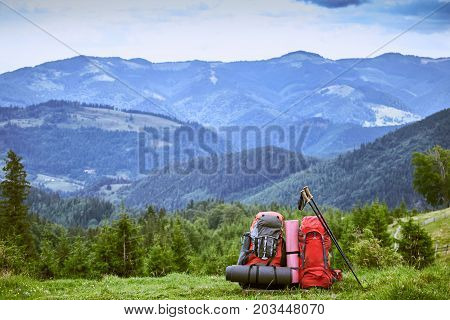 Backpacks in the mountains with views of the mountains.